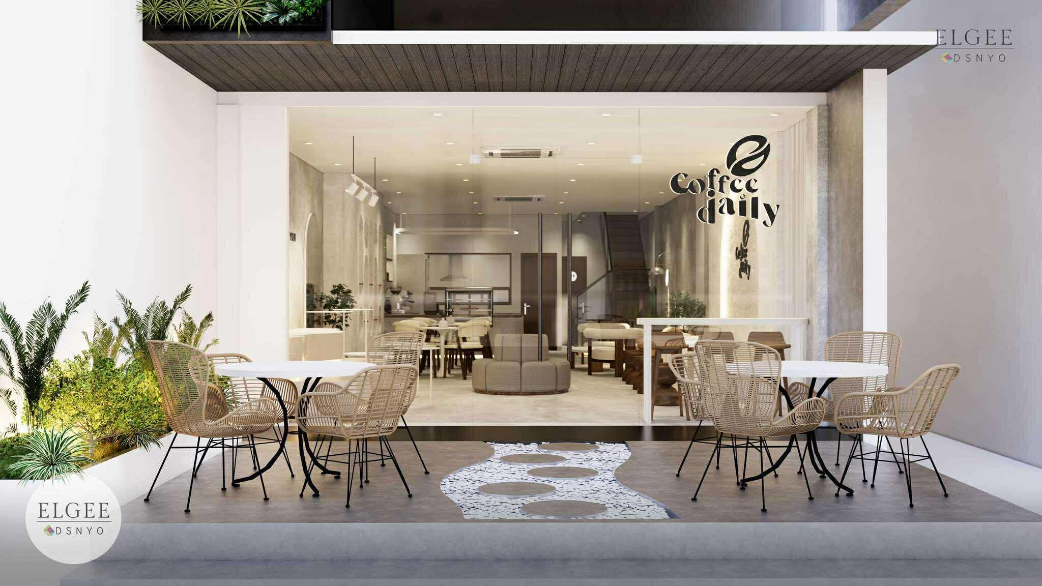 Modern coffee shop storefront featuring outdoor wicker seating and a glass front revealing the interior.