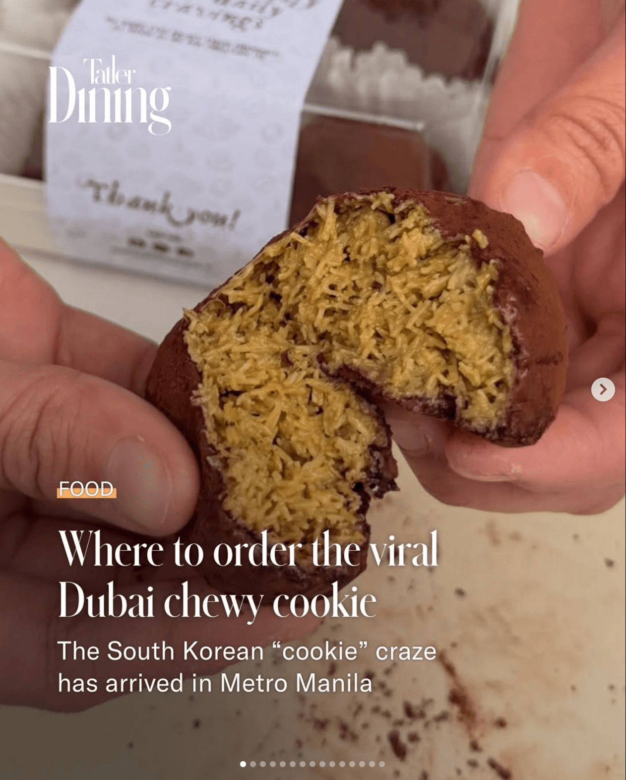 Hands breaking open a chocolate-coated cookie filled with a dense, golden shredded kataifi pastry.